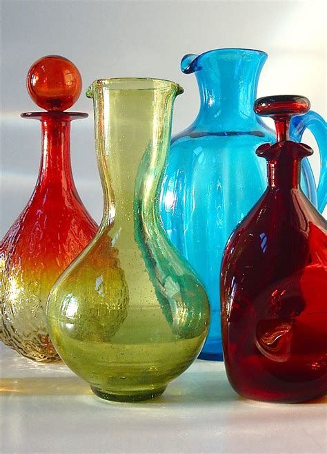 Blenko glass - This bottle is a favorite of ours precisely because it captures the exact hand - and moment of time - in the process of its making. Art glass by Appalachian artisans in homage to the master artist — an irresistible treasure. 8” tall, 6.5” wide. Holds up to 36 fluid ounces. 100% handmade by Appalachians in West Virginia.